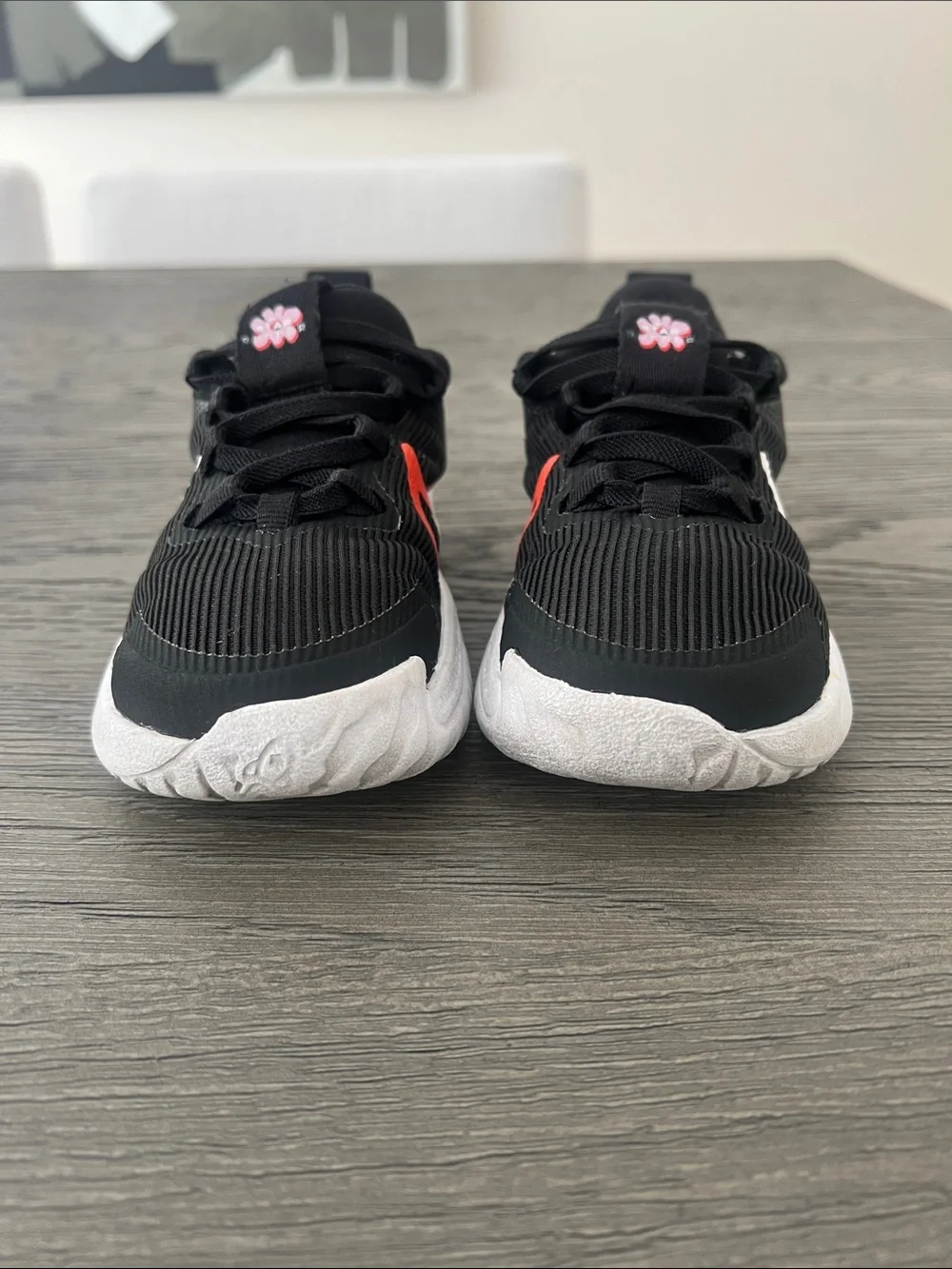 Nike Kids Black Sneakers with White & Red Swoosh and Pink Flower Accents